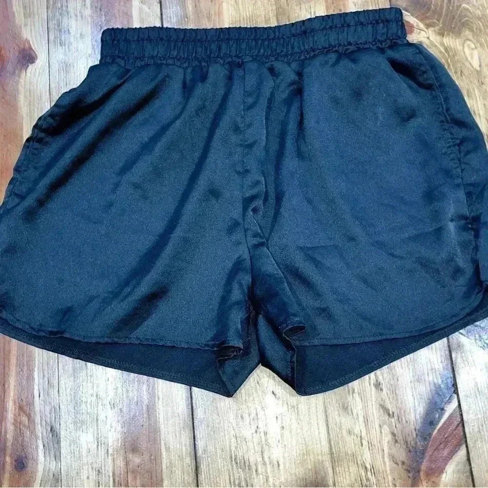 Daly silky black sleep shorts with front pockets and faux back pockets